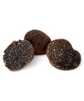 Fresh black truffle Tuber Melanosporum with three black truffles for gourmet cooking